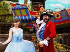 Princesses, Pirates & Pure Family Chaos: Gulliver’s Bank Holiday Takeover Princess in a light blue gown posing with a man in a red pirate coat beside a colorful ship at a theme park.