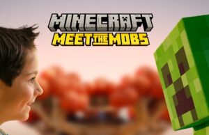 Minecraft: Meet the Mobs at Alton Towers Boy gazes at a green Creeper from Minecraft with the 'Minecraft Meet the Mobs' logo above.