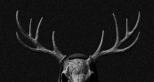 Book Blackout: Ritual Now – London Dungeon’s Limited-Time Horror Event Dark hooded figure wearing a deer skull mask with large antlers against a black background.