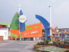 Blackpool Pleasure Beach Rides for Under 2s: What Can Toddlers Ride? Colorful Nickelodeon Land entrance with green and blue curved structures and an orange building in the background labeled Streak