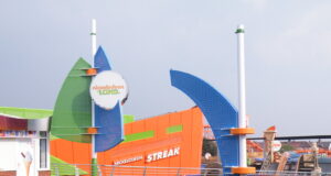 Blackpool Pleasure Beach Rides for Under 2s: What Can Toddlers Ride? Colorful Nickelodeon Land entrance with green and blue curved structures and an orange building in the background labeled Streak