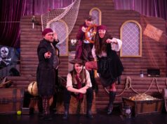 Clacton Pier’s New Pirates Ahoy! Event Draws Huge Crowds During May Half Term Four pirates on a wooden ship set, striking dramatic poses and pointing at the viewer.