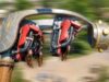 ROTOR Opening 31st July 2026 at Crealy Theme Park & Resort Suspended amusement-park ride with red-seat cars rotating on a large mechanical arm shaped like a fantasy creature.