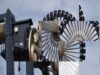 UK Theme Park Spy Launches Free Online Games Hub for Theme Park Fans Close-up of a large amusement ride wheel with passenger cars around the rim against a blue sky craft a Ferris wheel image