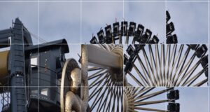 Play Theme Park Shuffle Puzzle Close-up of a large amusement ride wheel with passenger cars around the rim against a blue sky craft a Ferris wheel image