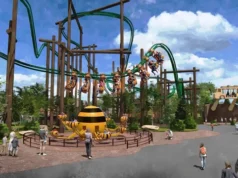 Six Flags Great America Announces Camp Timber Trail, An All-New Family Adventure for 2027 Bee-themed playground with elevated green track, wooden beams, and children riding bee-shaped cars around a large striped bee centerpiece.